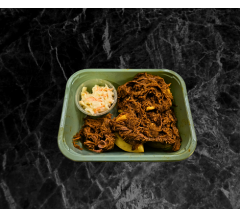 Home made Pulled Beef brisket on a baked potato with coleslaw